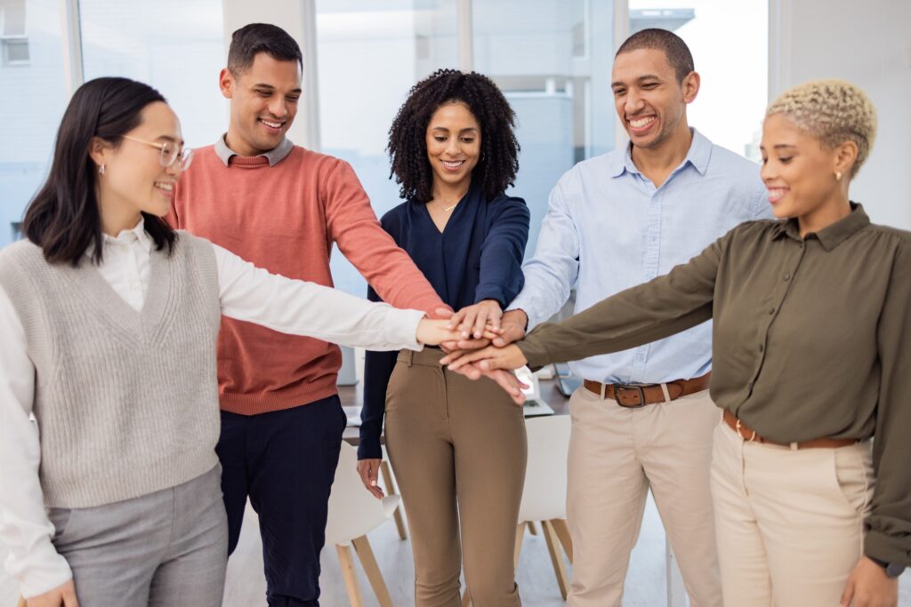 Team work, hands or happy business people in meeting together in a branding or group project for mo